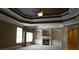 Spacious main bedroom with a fireplace, built-in shelves, and large windows for natural light at 4663 Mossey Dr, Lithonia, GA 30038