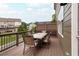 Outdoor dining on a wooden deck with a table and chairs, great for relaxation at 318 Lantana Ln, Woodstock, GA 30188