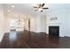 Open-concept living area with fireplace, hardwood floors, and seamless flow to the kitchen at 318 Lantana Ln, Woodstock, GA 30188