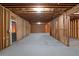 Unfinished basement featuring concrete floor and exposed wood framing at 3692 Wartrace Dr, South Fulton, GA 30331