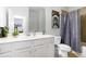 Clean, functional bathroom features white cabinets, a shower/tub combo, and neutral decor at 3692 Wartrace Dr, South Fulton, GA 30331