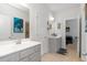 Well-lit bathroom with white countertops and gray vanities, providing a clean and modern aesthetic at 3692 Wartrace Dr, South Fulton, GA 30331