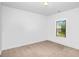 This bedroom has neutral carpet, white walls and a window with lots of natural light at 3692 Wartrace Dr, South Fulton, GA 30331