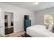 Bright bedroom with a bed, closet and window allowing plenty of natural light at 3692 Wartrace Dr, South Fulton, GA 30331