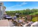 Outdoor deck area with cozy seating, grill, and view of lush greenery perfect for relaxation at 3692 Wartrace Dr, South Fulton, GA 30331