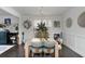 Elegant dining room with a modern chandelier, stylish seating, and decorative wall art at 3692 Wartrace Dr, South Fulton, GA 30331