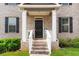 Inviting front porch with brick steps, white columns, and a decorative 'welcome' sign at 3692 Wartrace Dr, South Fulton, GA 30331