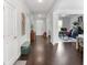 Spacious hallway with gleaming hardwood floors, leading to various rooms and featuring stylish decor at 3692 Wartrace Dr, South Fulton, GA 30331