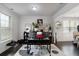 Bright home office featuring large windows, a modern desk setup, and tasteful decor at 3692 Wartrace Dr, South Fulton, GA 30331