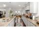 A well lit kitchen that features granite countertops, stainless steel appliances, and a breakfast bar at 3692 Wartrace Dr, South Fulton, GA 30331