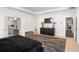 Bright main bedroom with a large rug, dark furniture, and contemporary design for a relaxing retreat at 3692 Wartrace Dr, South Fulton, GA 30331