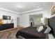 Spacious main bedroom features dark wood furniture, carpet, and many windows for natural light at 3692 Wartrace Dr, South Fulton, GA 30331