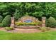 Community entrance sign with lush landscaping, stone accents, and welcoming neighborhood name at 3692 Wartrace Dr, South Fulton, GA 30331