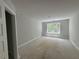 A bright bedroom with natural light coming through a window overlooking the exterior at 5361 Tuscany Dr, Douglasville, GA 30135