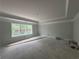 Spacious bedroom featuring tray ceiling, natural light, and room to create a luxurious retreat at 5361 Tuscany Dr, Douglasville, GA 30135