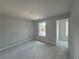 A bright bedroom with natural light coming through two windows overlooking the exterior at 5361 Tuscany Dr, Douglasville, GA 30135