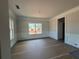 Bright living room showcasing decorative trim, neutral walls, and large windows for natural light at 5361 Tuscany Dr, Douglasville, GA 30135