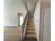 Interior staircase with decorative iron railing leading to the upper level of the home at 5361 Tuscany Dr, Douglasville, GA 30135