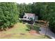 Aerial view of beautiful house, pool, and manicured landscaping at 6095 Fords Nw Rd, Acworth, GA 30101