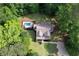 Aerial view of a home with a private pool and lush green surroundings at 6095 Fords Nw Rd, Acworth, GA 30101