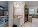 Bathroom features neutral tile, walk-in shower with a glass door, and a soaking tub at 6095 Fords Nw Rd, Acworth, GA 30101