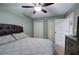 Cozy bedroom featuring a comfortable bed, carpet, and ample closet space at 6095 Fords Nw Rd, Acworth, GA 30101