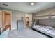 Carpeted bedroom with a bunk bed, dresser, closet, and calming gray walls offers a relaxing and functional space at 6095 Fords Nw Rd, Acworth, GA 30101