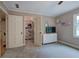 Neutral bedroom featuring carpet, a window, shelving, and a closet for storage and natural light at 6095 Fords Nw Rd, Acworth, GA 30101