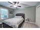 Comfortable bedroom with cozy bed, carpet, and natural light from the window at 6095 Fords Nw Rd, Acworth, GA 30101