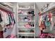 Walk-in closet with built-in shelving and storage for clothes, shoes, and toys with open access at 6095 Fords Nw Rd, Acworth, GA 30101