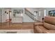Spacious foyer with wood floors, staircase and decorative cabinet at 6095 Fords Nw Rd, Acworth, GA 30101