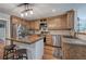 Well-equipped kitchen with an island, stainless steel appliances, and wood cabinets at 6095 Fords Nw Rd, Acworth, GA 30101