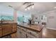Kitchen with wood cabinets, an island, and an open layout, flowing into the living room at 6095 Fords Nw Rd, Acworth, GA 30101