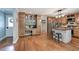 Charming kitchen with wood cabinets, stainless steel fridge, and a breakfast bar at 6095 Fords Nw Rd, Acworth, GA 30101