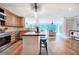 Well-lit kitchen featuring a breakfast bar, stainless steel appliances, and hardwood floors at 6095 Fords Nw Rd, Acworth, GA 30101