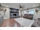 Spacious living room with hardwood floors, brick fireplace, and comfortable seating at 6095 Fords Nw Rd, Acworth, GA 30101