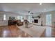Spacious living room with fireplace, comfortable seating, and beautiful hardwood floors at 6095 Fords Nw Rd, Acworth, GA 30101