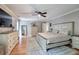 Spacious primary bedroom boasts hardwood floors, neutral walls, and a ceiling fan at 6095 Fords Nw Rd, Acworth, GA 30101