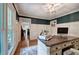 Bright office with wainscoting and a view into the living room with hardwood floors at 6095 Fords Nw Rd, Acworth, GA 30101