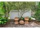 Charming backyard featuring a brick patio with seating area, and lush greenery at 859 Scales Rd, Suwanee, GA 30024