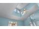 Vaulted ceiling with a fan and skylights providing ample natural light at 859 Scales Rd, Suwanee, GA 30024
