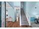 Welcoming foyer with hardwood floors and a staircase leading to the upper level at 859 Scales Rd, Suwanee, GA 30024