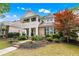 Inviting front exterior with a covered porch and beautifully landscaped yard at 859 Scales Rd, Suwanee, GA 30024