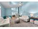 Bright living room featuring a vaulted ceiling, a ceiling fan, plush carpeting and comfortable seating at 859 Scales Rd, Suwanee, GA 30024