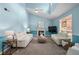 Bright living room with a fireplace, vaulted ceilings, and comfortable white sofas at 859 Scales Rd, Suwanee, GA 30024