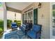 Cozy porch with a comfortable seating area, perfect for relaxing outdoors at 859 Scales Rd, Suwanee, GA 30024