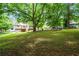 Backyard with a large lawn, wooden deck, swing set and outdoor furniture at 115 Bennett Farms Dr, Acworth, GA 30102