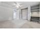 Finished basement with neutral carpet and paint features a storage closet and built-in desk at 115 Bennett Farms Dr, Acworth, GA 30102