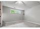 Finished basement with neutral carpet and paint with a window to let in natural light at 115 Bennett Farms Dr, Acworth, GA 30102