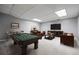 Basement game room with a pool table, furniture and large screen television at 115 Bennett Farms Dr, Acworth, GA 30102